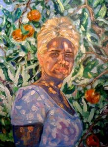 Portret kobiety pod drzewkiem pomarańczowym